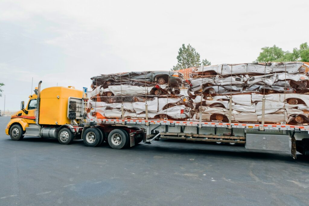 Industrial scrap cars on flatbed truck
